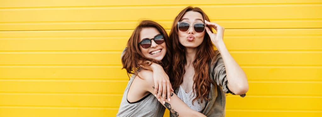 two young women happy with good teeth