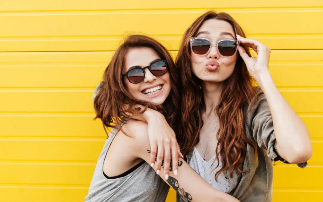 two young women happy with good teeth